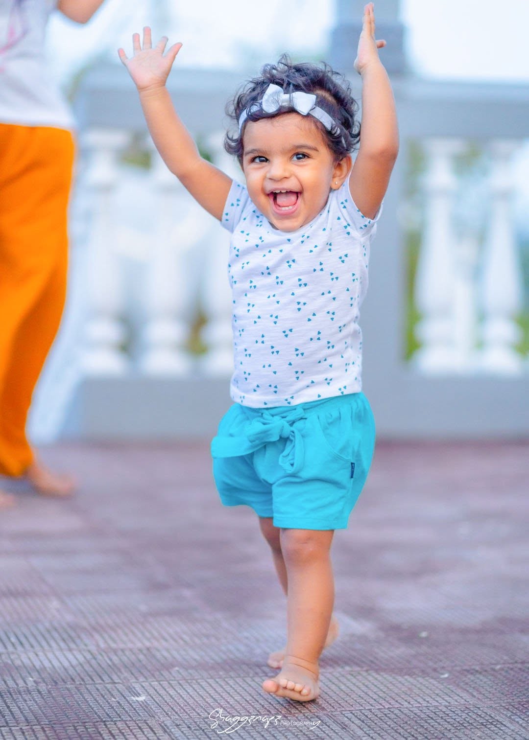 Baby portrait photoshoot with hands raised in Colombo, Sri Lanka