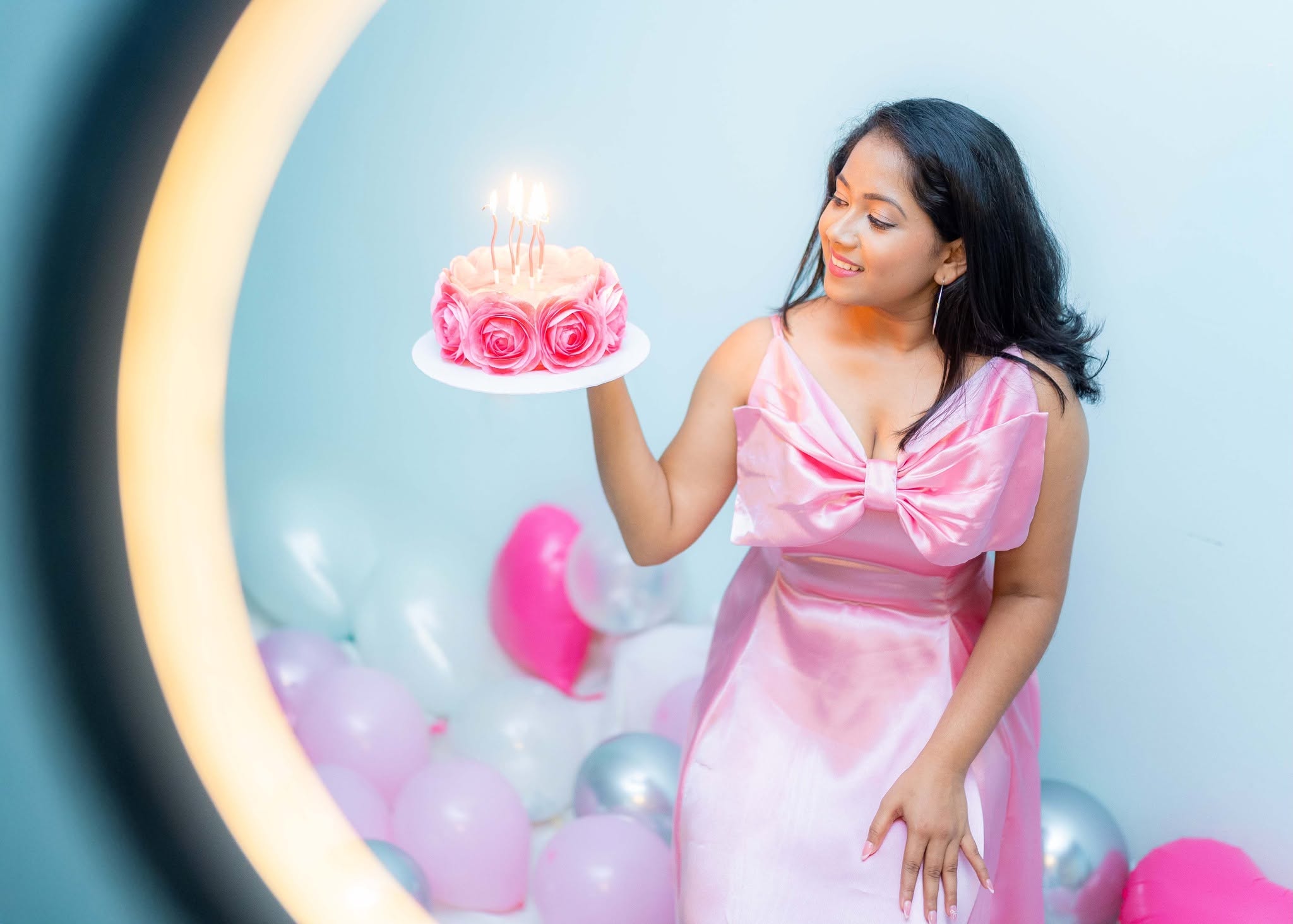 21st birthday photoshoot holding a lit birthday cake with pink balloons, Colombo, Sri Lanka