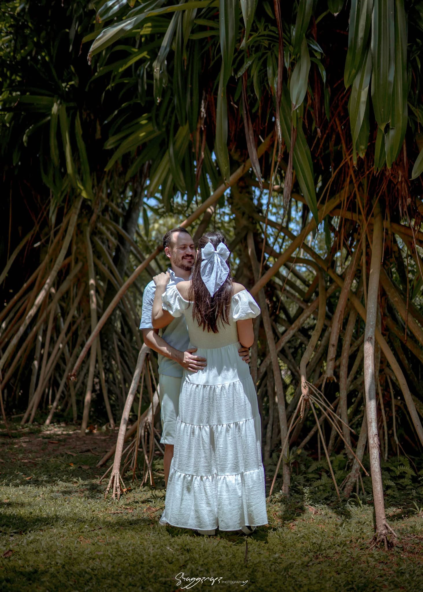 Couple portrait photoshoot from behind among palm trees in Colombo, Sri Lanka