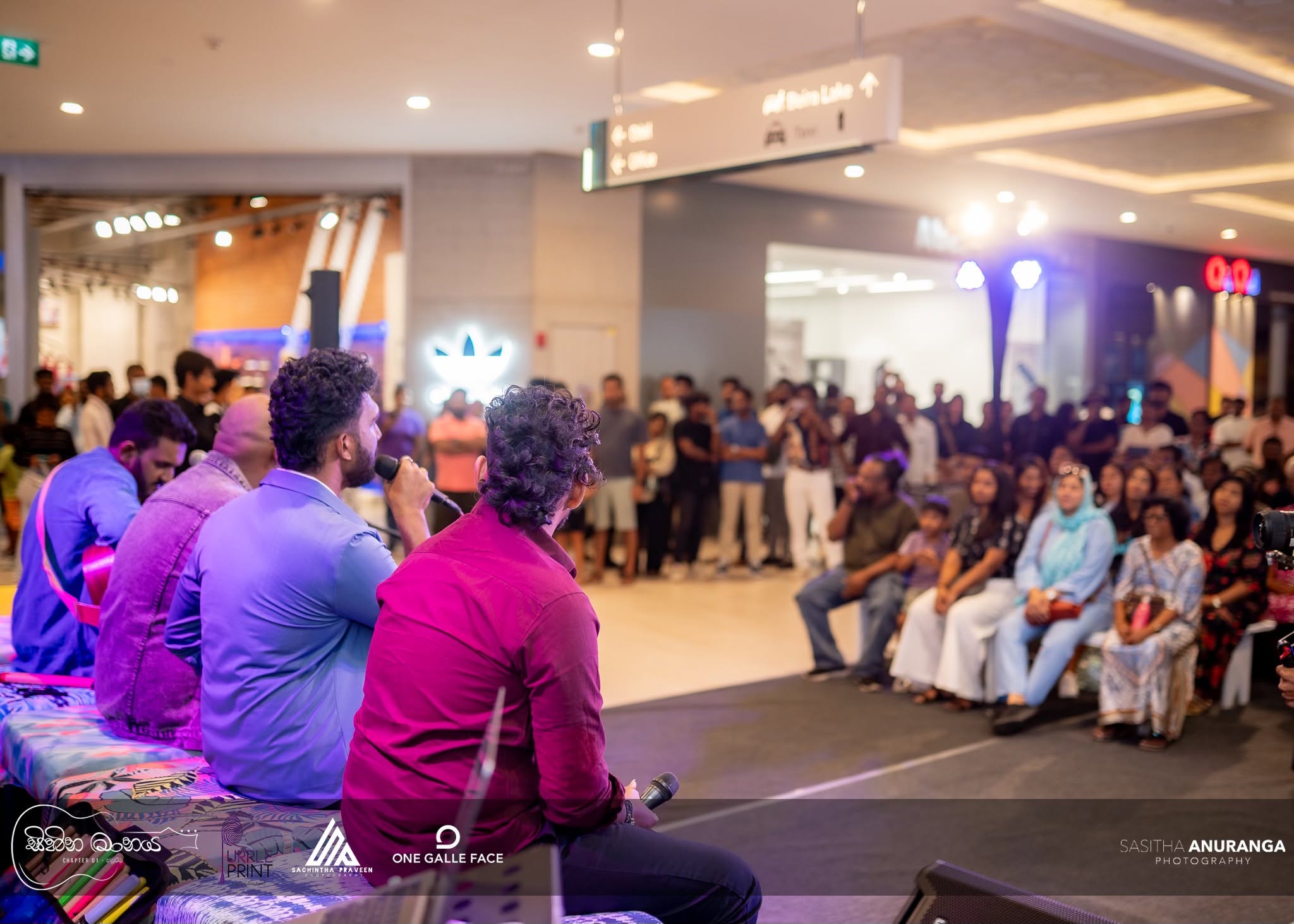 Event photography of musicians performing for the crowd at Sihina Maanaya, One Galle Face mall