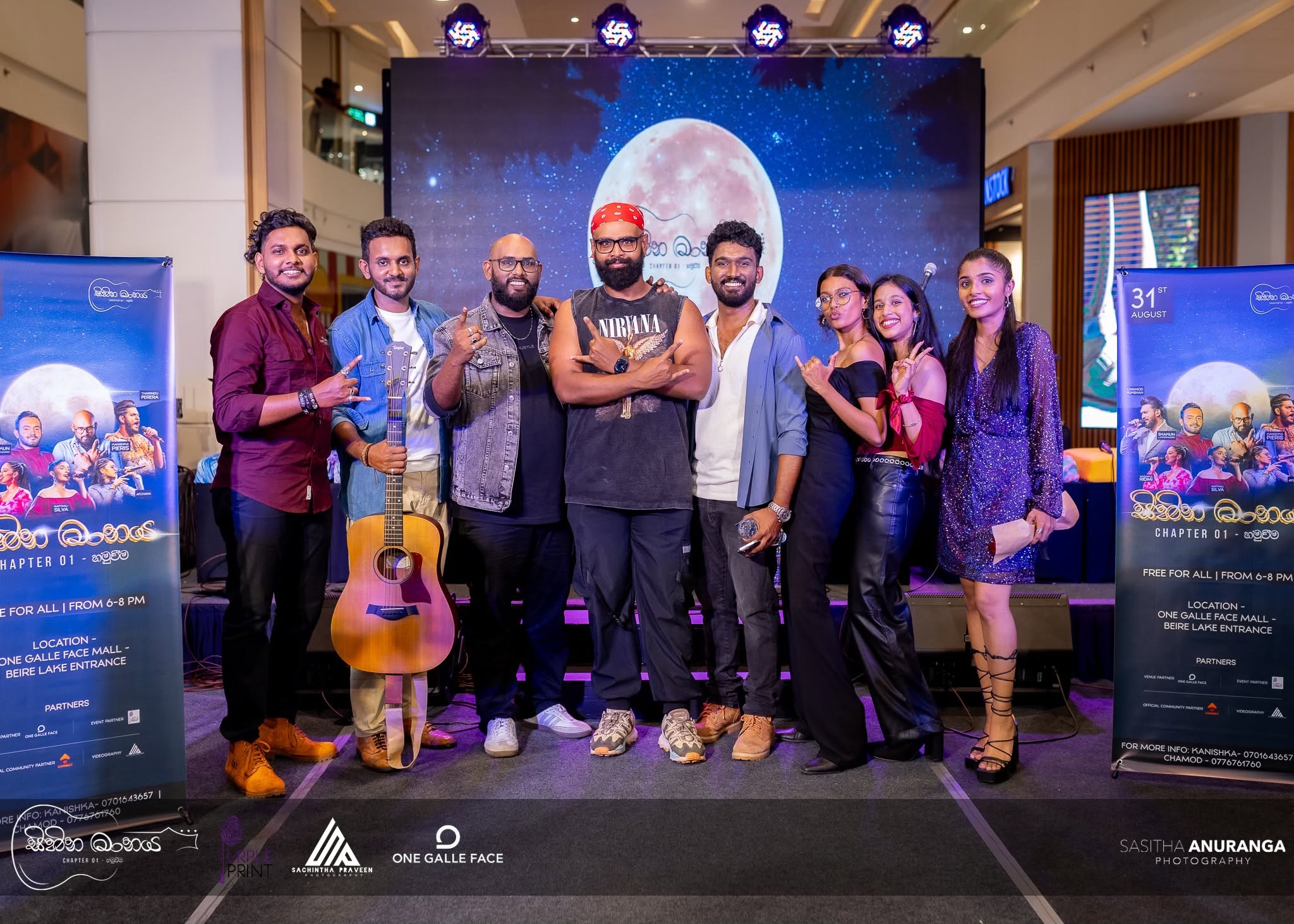 Event photography group portrait of performers beside the Sihina Maanaya stage, One Galle Face mall