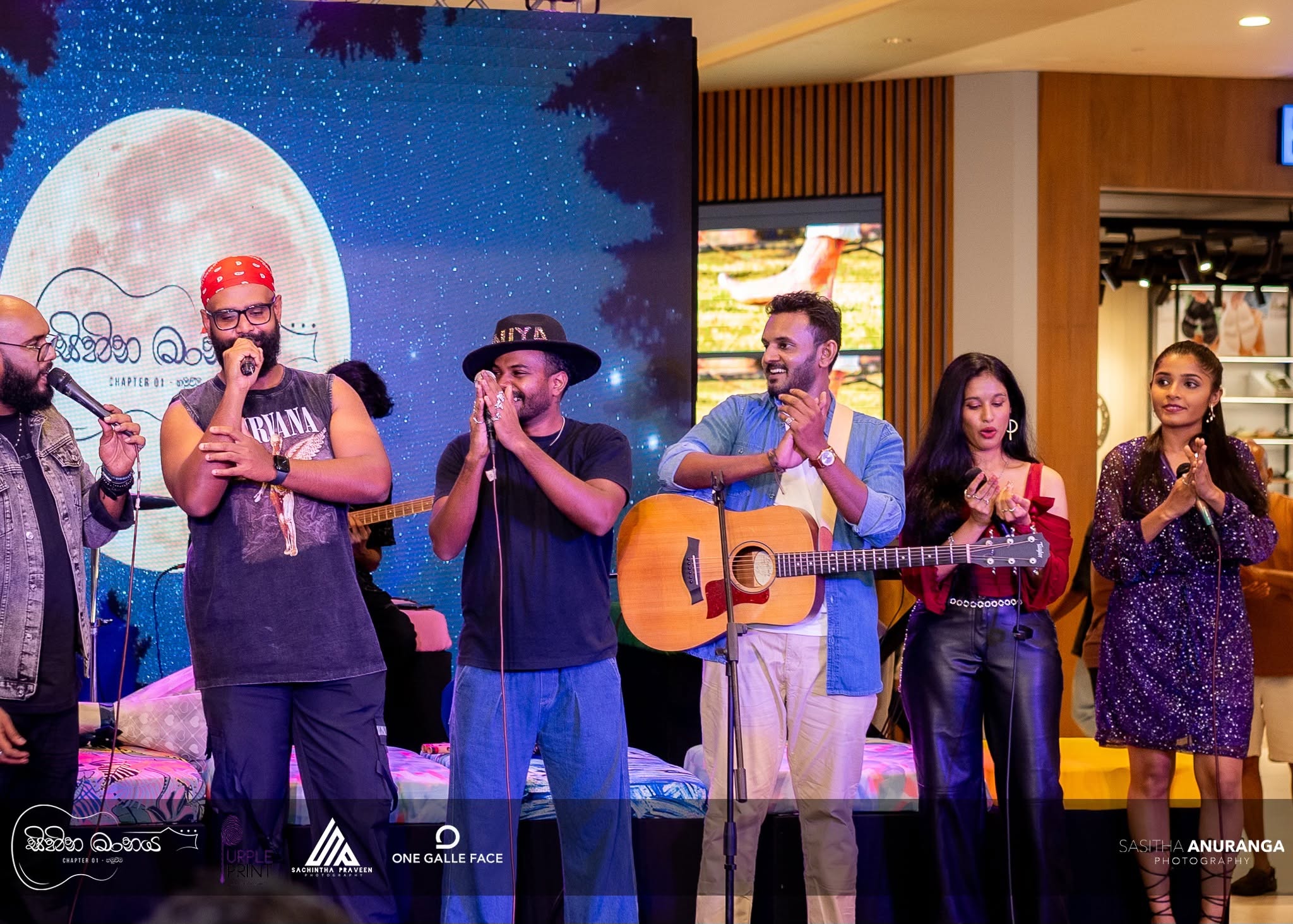 Event photography of musicians performing on stage at Sihina Maanaya, One Galle Face mall