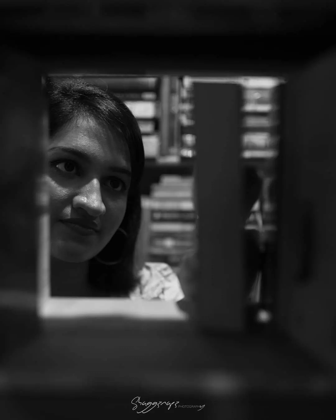 Black and white creative fashion portrait in a bookstore, Colombo, Sri Lanka