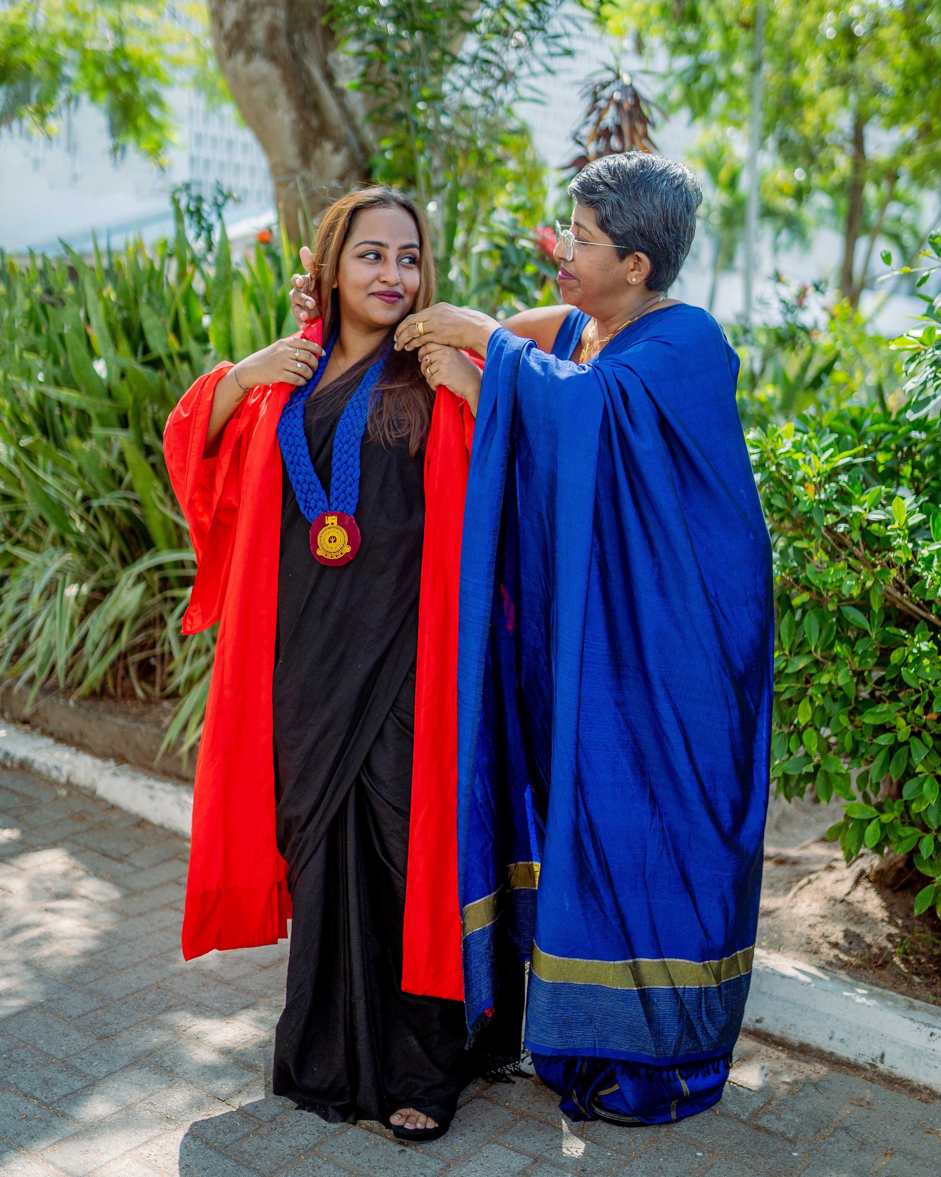 Graduation portrait photography with a mother placing a ceremonial medal, Colombo, Sri Lanka