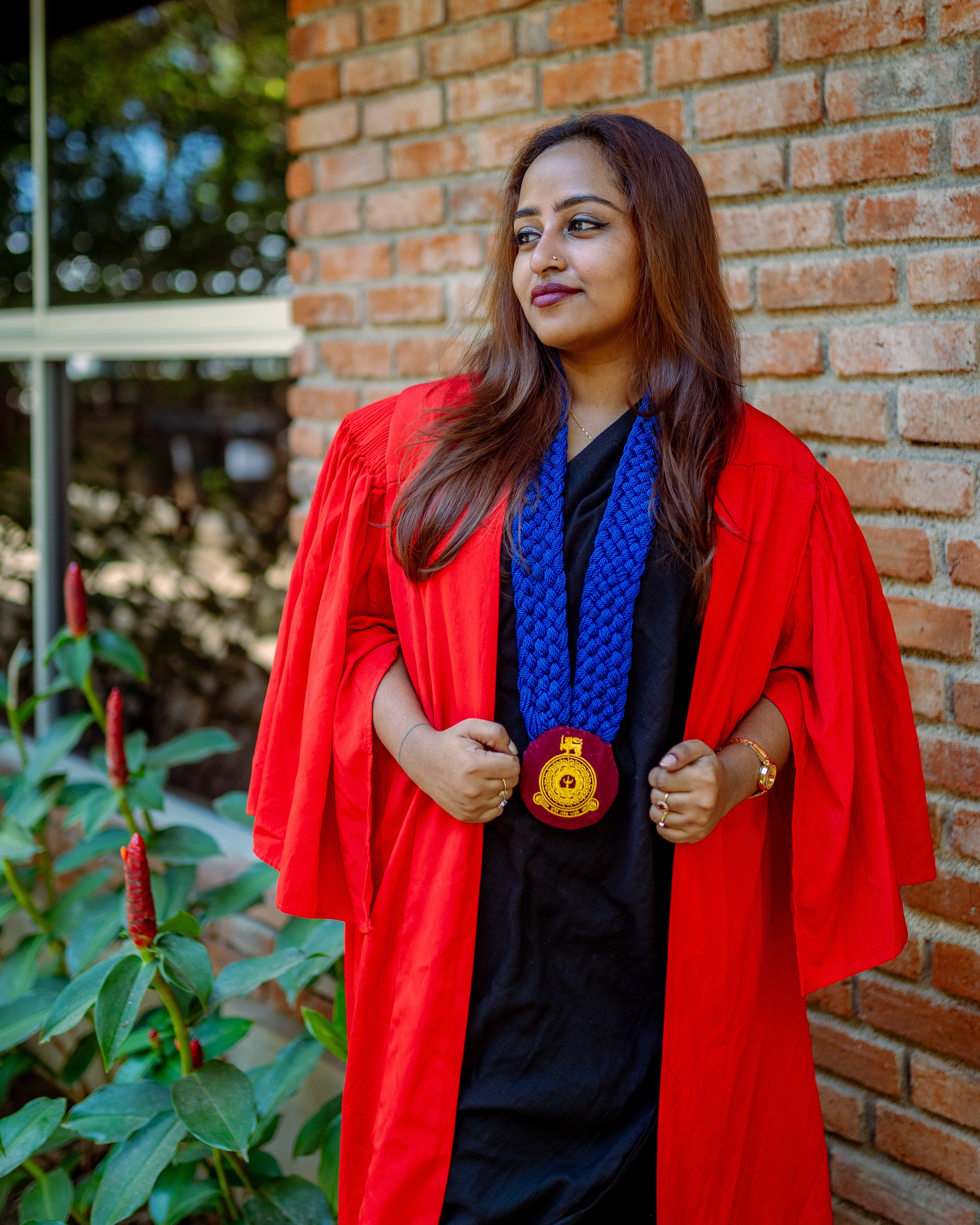 Graduation portrait photography looking aside against a brick wall, Colombo, Sri Lanka
